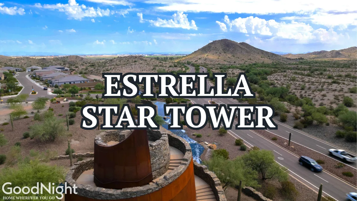 A wide desert landscape featuring the striking Estrella Star Tower set against mountains, with open sky and natural terrain. The scene highlights the area's adventurous spirit, desert beauty, and opportunities for outdoor exploration such as hiking and stargazing.