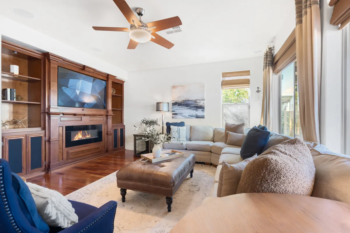 A comfortable living area centered around a modern electric fireplace and Smart TV, with a stylish sofa and coffee table creating a cozy focal point. This is an ideal spot for movie nights or unwinding after a day of adventure.
